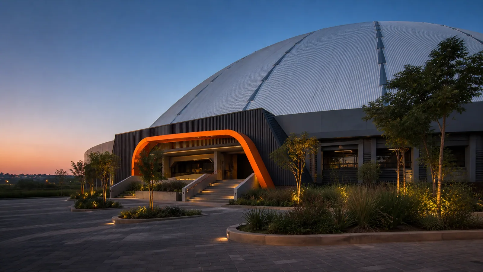 Wesslink artistic impression of the WeBuyCars Dome exterior in Northriding, showing its huge silver ribbed roof, charcoal entrance block, orange arch, steps and landscaped forecourt.